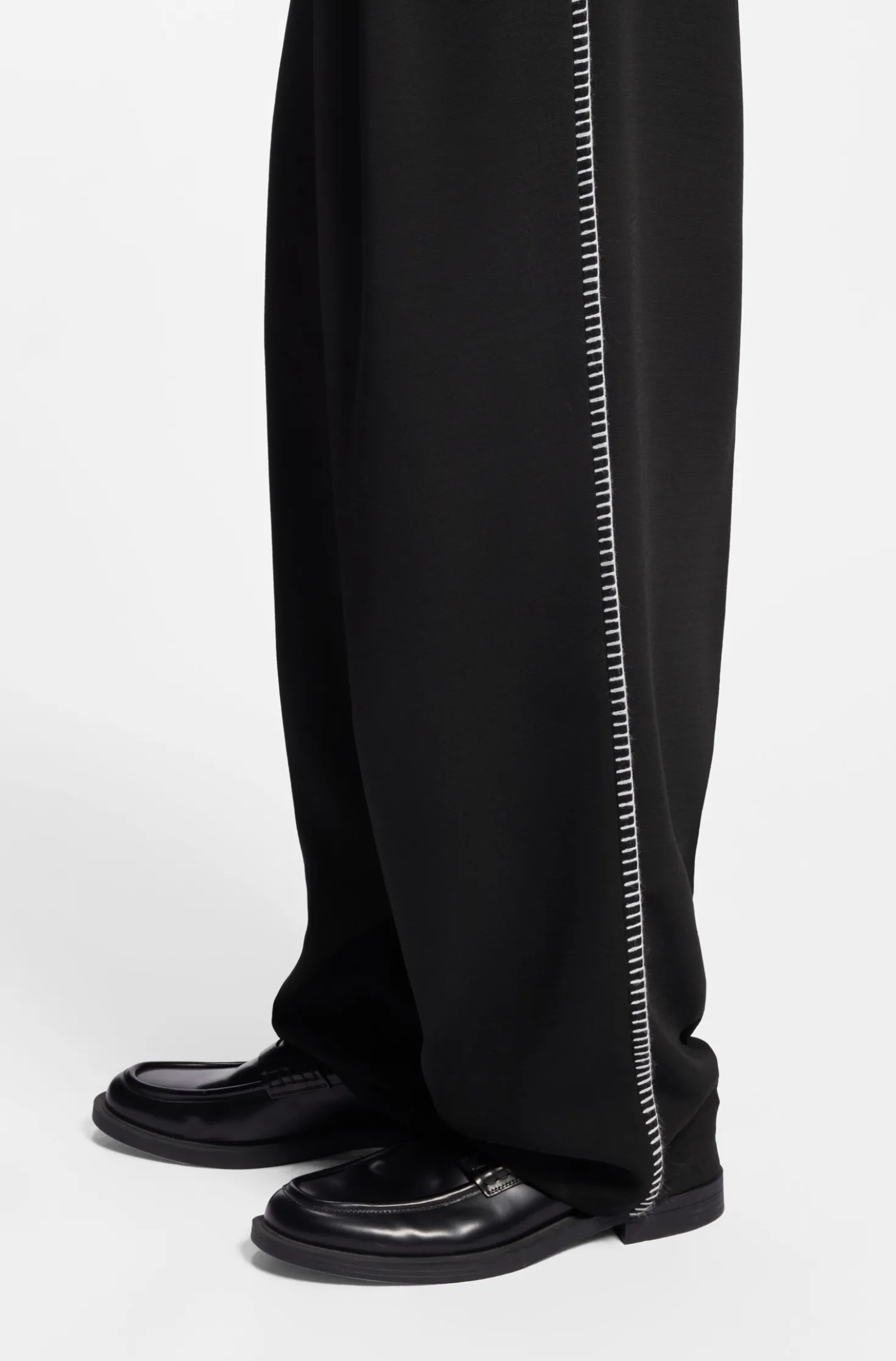 Pleat-front trousers with whipstitch details