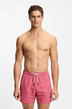 Printed swim shorts with logo badge