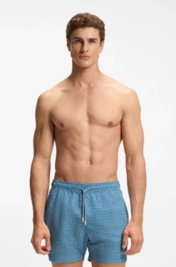 Printed swim shorts with logo badge