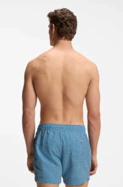 Printed swim shorts with logo badge