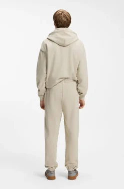 Relaxed-fit tracksuit bottoms in cotton with logo trim