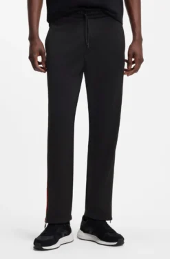 Relaxed-fit tracksuit bottoms with logo tape