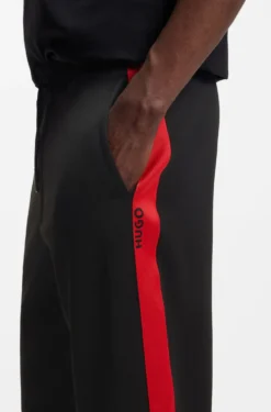 Relaxed-fit tracksuit bottoms with logo tape