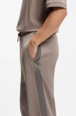 Relaxed-fit tracksuit bottoms with logo tape