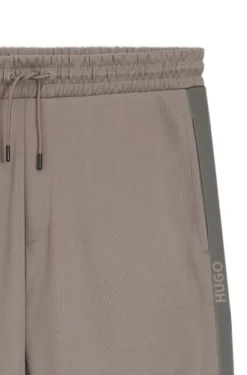 Relaxed-fit tracksuit bottoms with logo tape