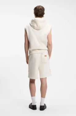 Sleeveless hoodie in cotton terry with logo badge