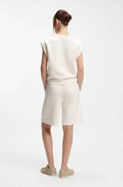 Sleeveless loose-fit sweatshirt with V-cut hemline