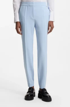 Slim-fit trousers in stretch fabric with logo rivet