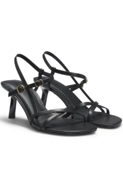 Strappy sandals in leather with asymmetric heel