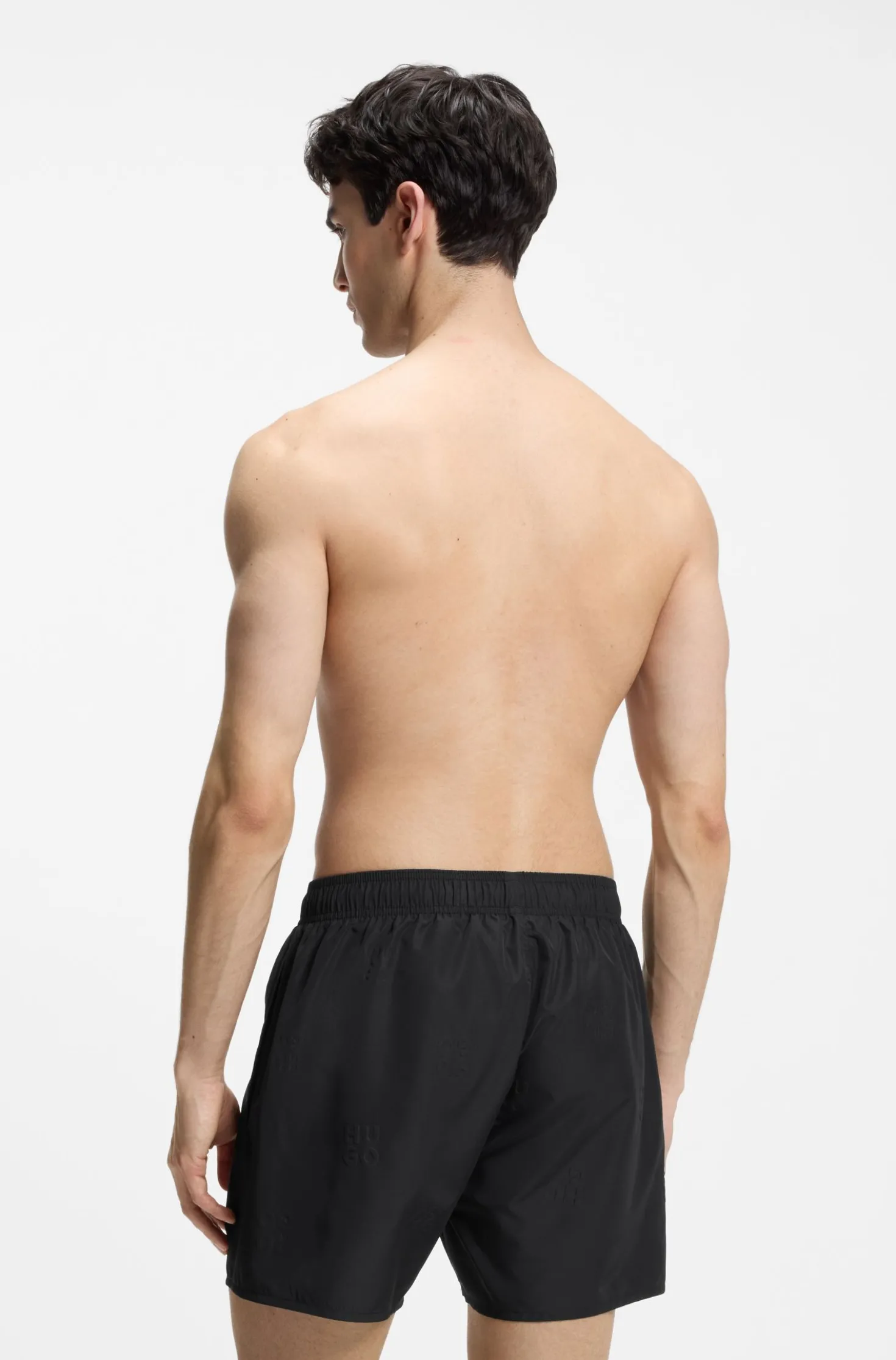 Swim shorts with all-over stacked logos