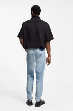 Tapered-fit jeans in light-blue distressed denim