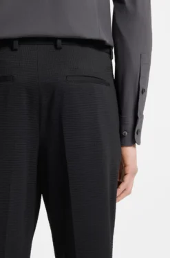 Tapered-fit trousers in stretch seersucker