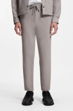 Tapered-fit trousers in waffle-structured stretch fabric