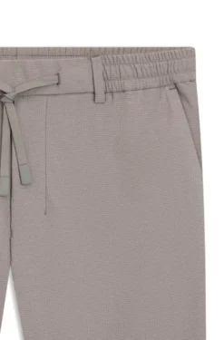 Tapered-fit trousers in waffle-structured stretch fabric