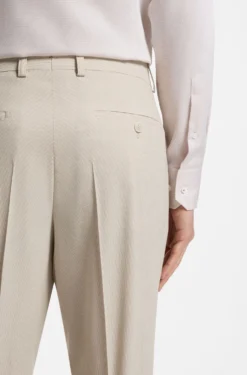 Tapered-fit trousers in wool-blend seersucker fabric