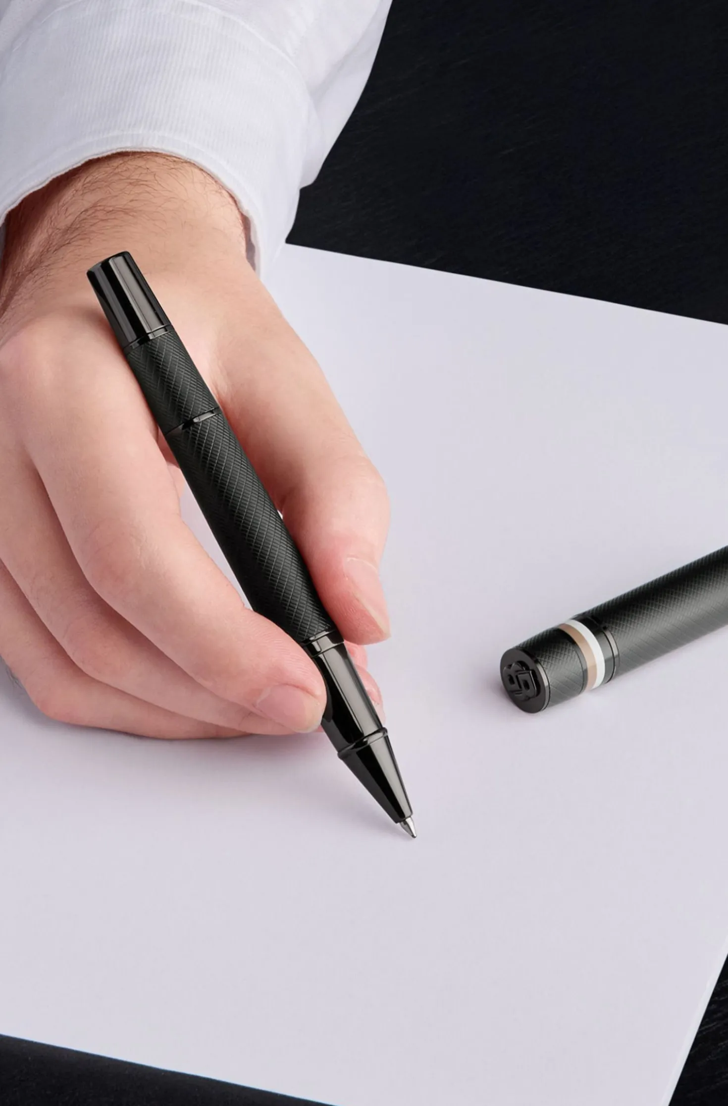 Textured-barrel rollerball pen with signature-stripe ring