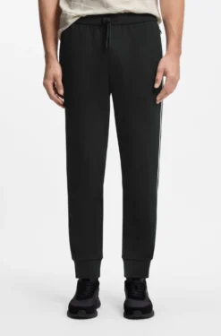 Triangle-jacquard tracksuit bottoms with rubberised logo