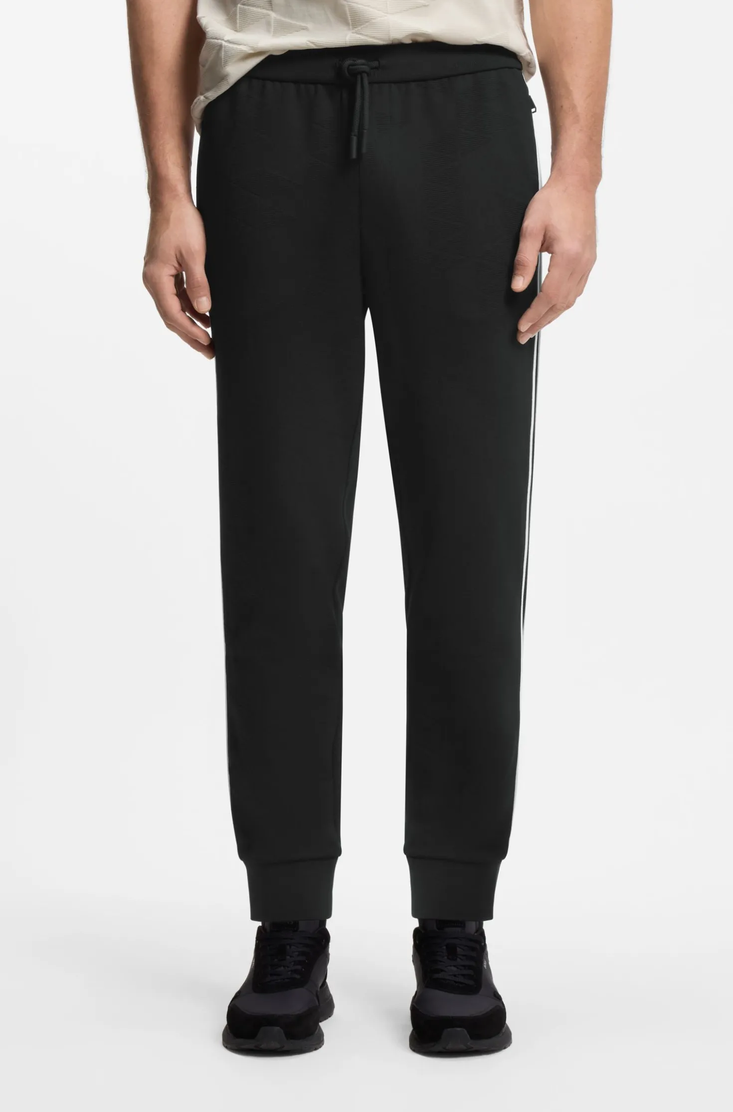 Triangle-jacquard tracksuit bottoms with rubberised logo