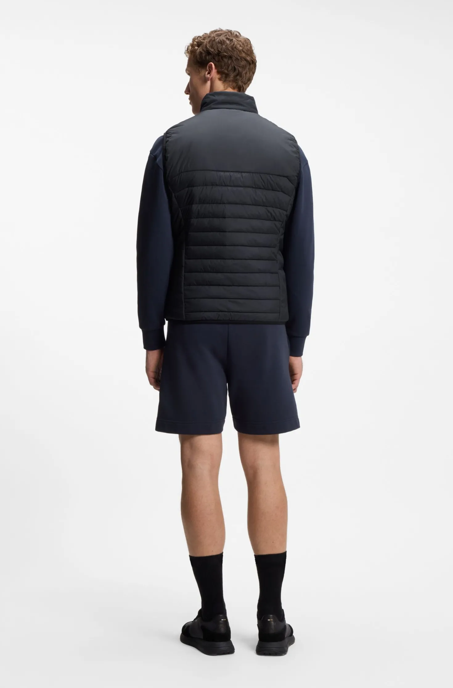 Water-repellent gilet with decorative reflective accents