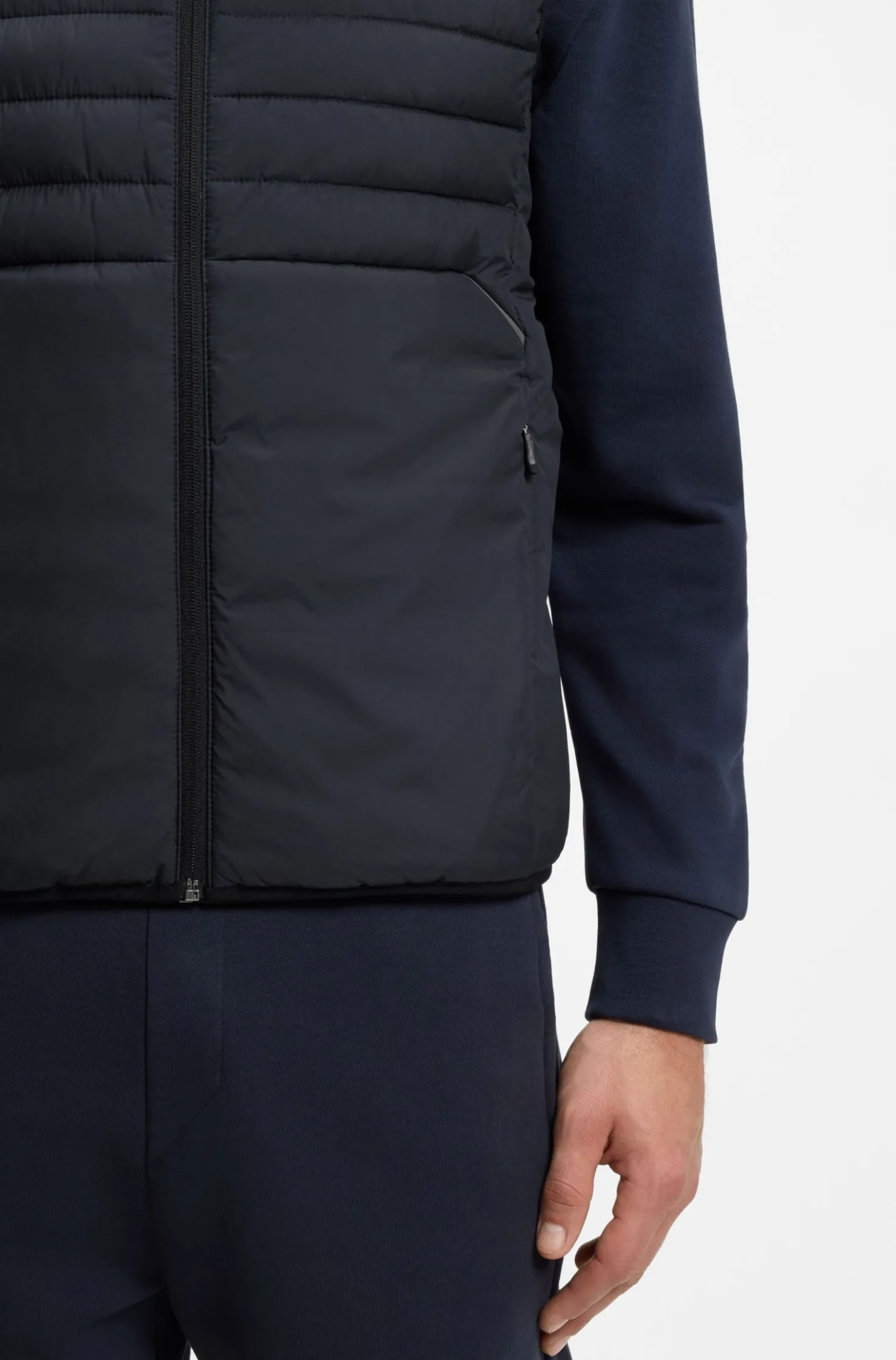 Water-repellent gilet with decorative reflective accents