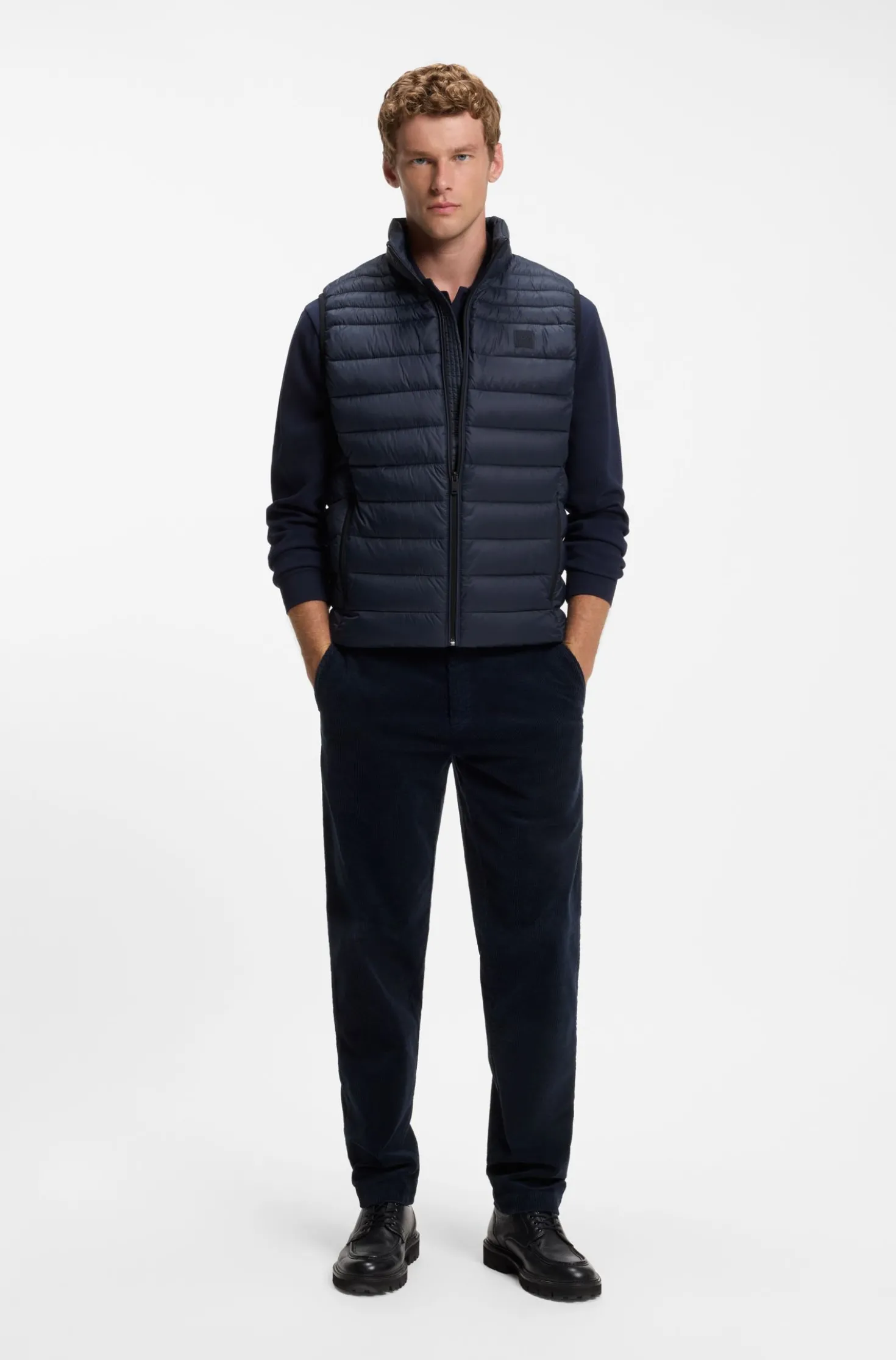 Water-repellent gilet with logo patch