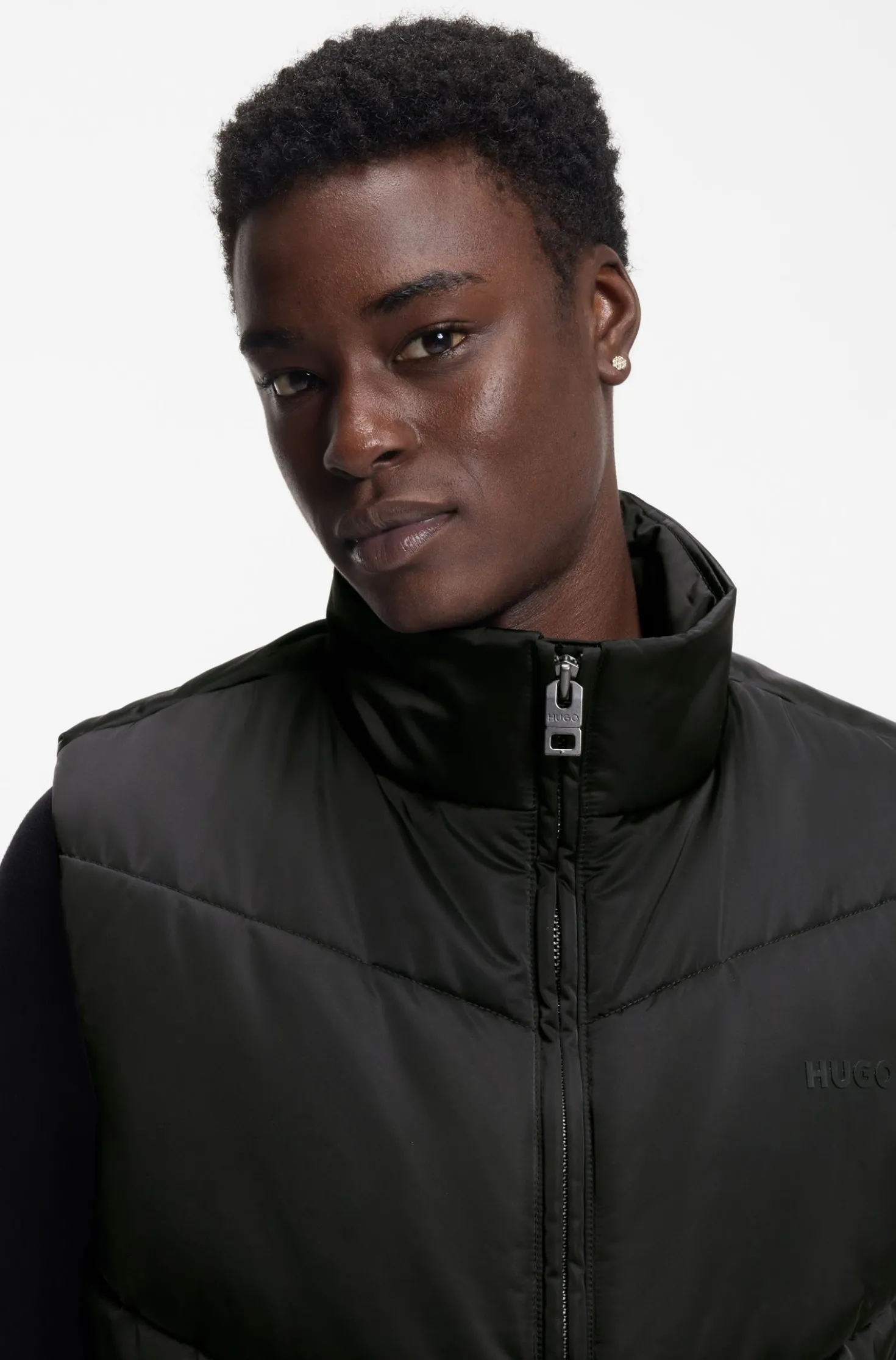 Water-repellent gilet with tonal logo