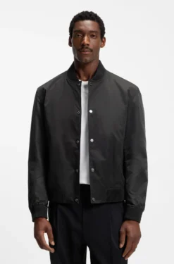 Water-repellent jacket with monogram-pattern sleeves