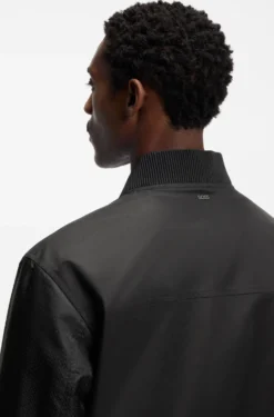 Water-repellent jacket with monogram-pattern sleeves