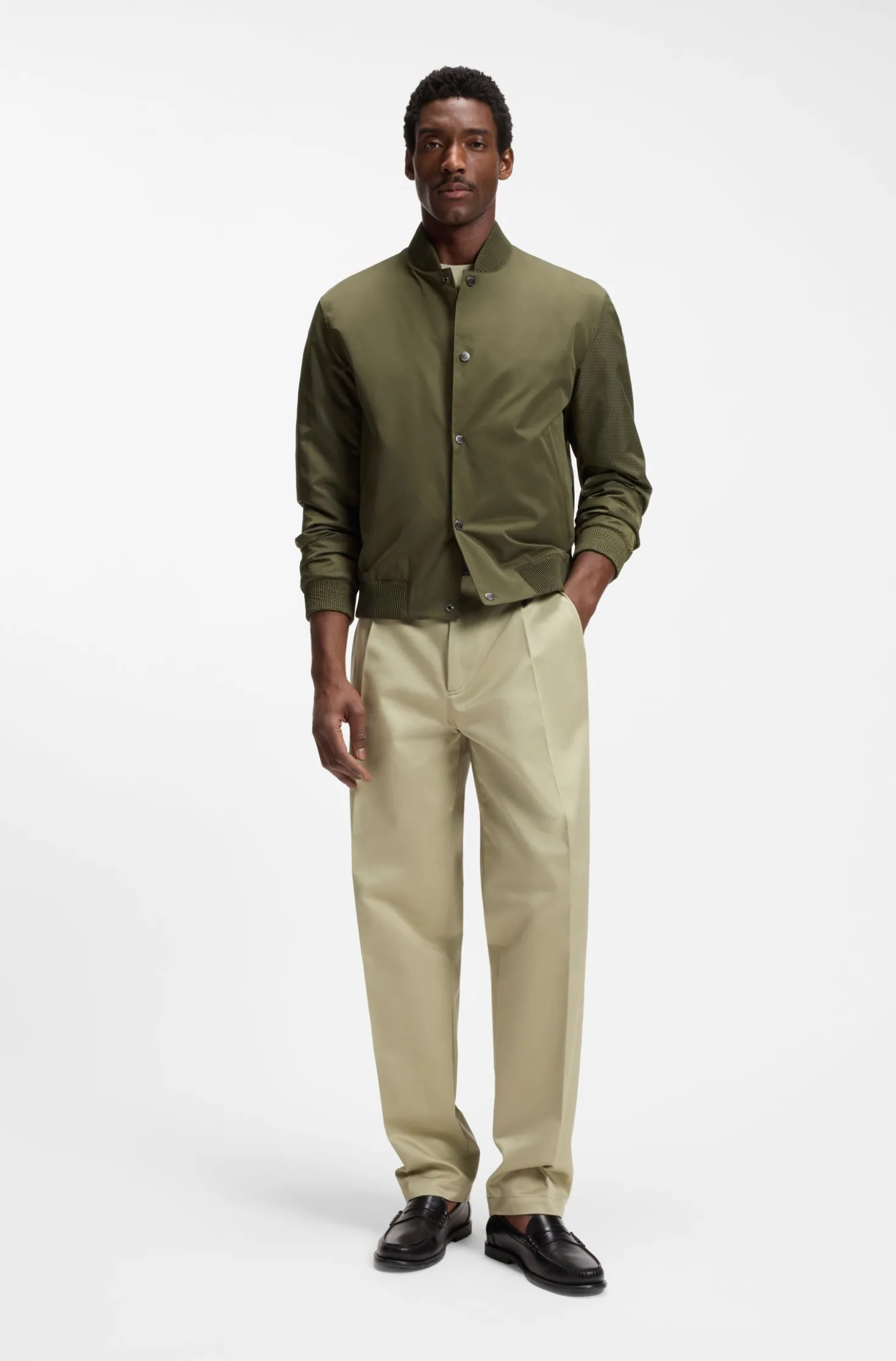 Water-repellent jacket with monogram-pattern sleeves