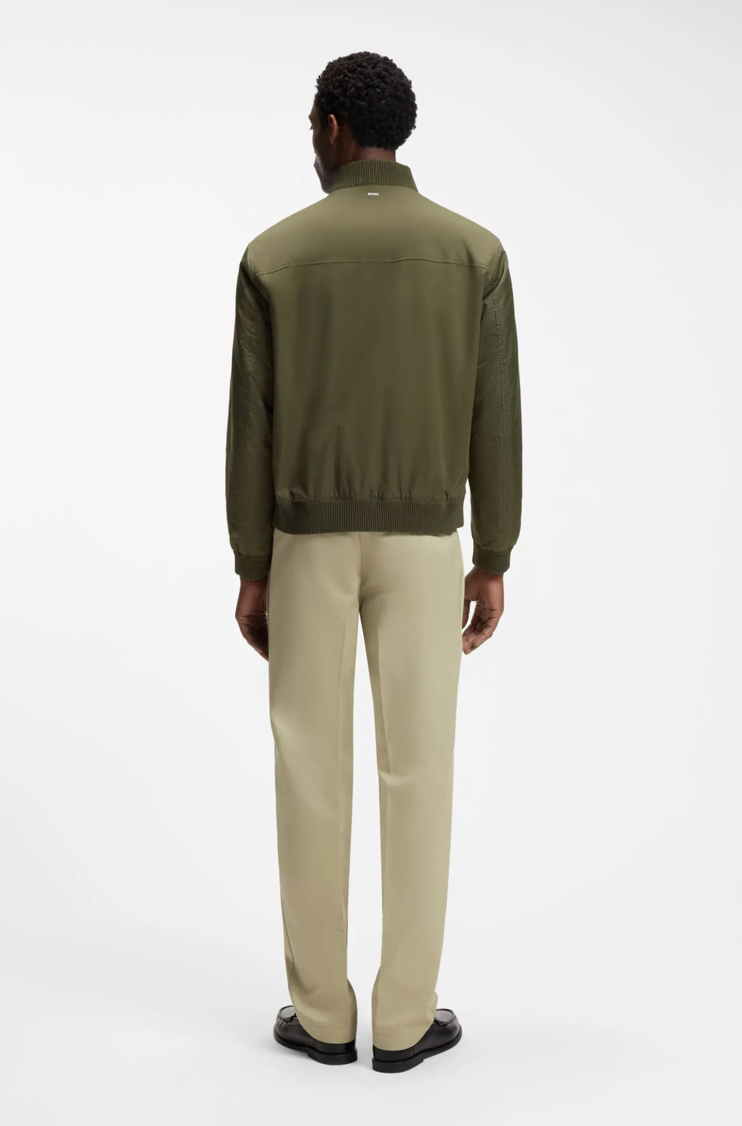 Water-repellent jacket with monogram-pattern sleeves