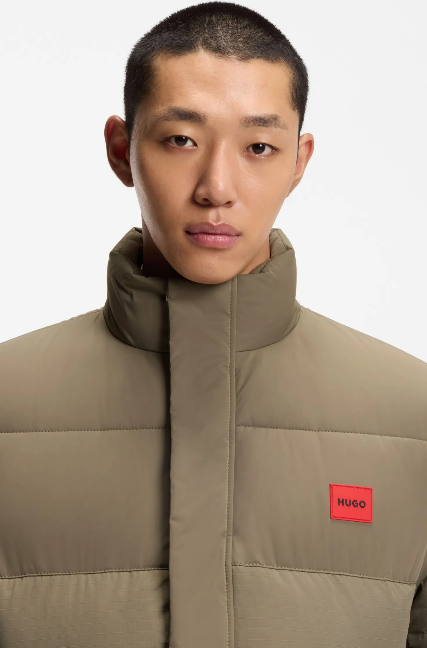 Water-repellent padded jacket with logo patch